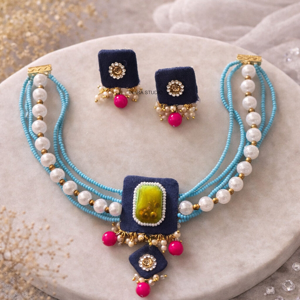 NAVY BLUE FABRIC MULTI LAYERED BEADED NECKLACE WITH STATEMENT STONE PENDANT